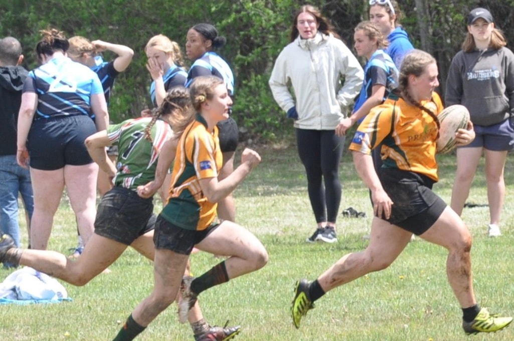 Girls rugby team having fun